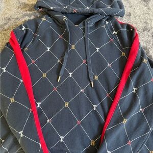 Tommy Hilfiger Blue Sweater with Unique Pattern and Red Accents
